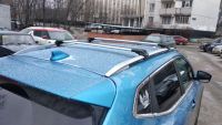 Багажник на крышу Nissan Qashqai, Turtle Air 1, аэродинамические дуги на рейлинги (серебристый цвет)