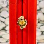 Кольцо с желтым камнем (США)